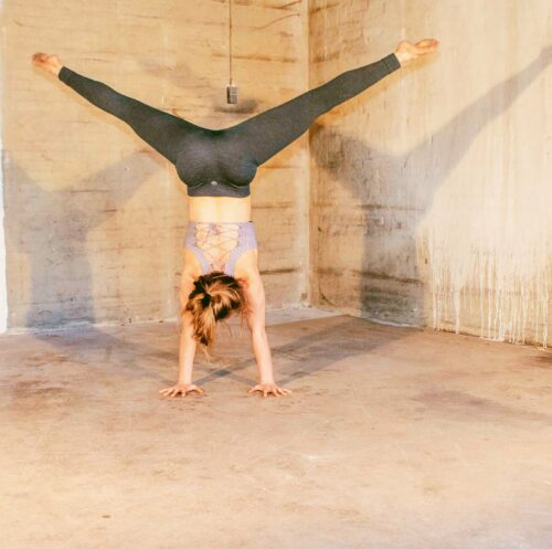 handstand alignment in a straddle handstand done by Camilla