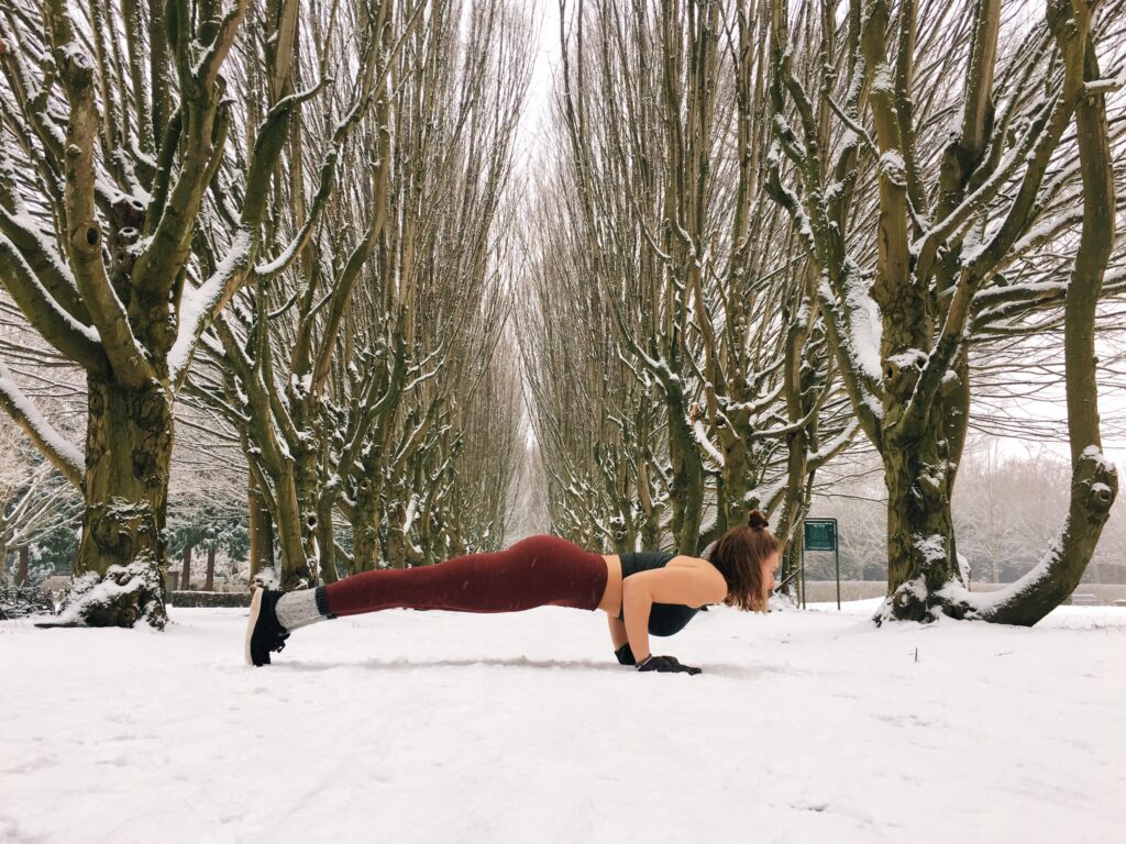 Chaturanga alignment yoga in the snow