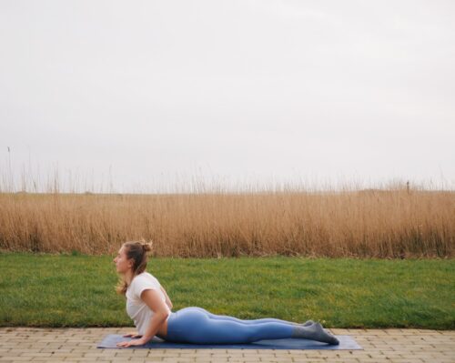 Camilla showing Cobra Pose (Bhujangasana) from the sun salutations in yoga