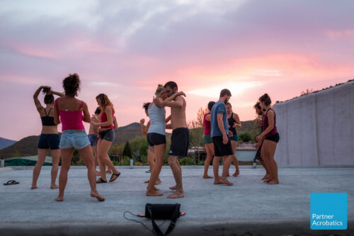 Rooftop dancing at partner acrobatics teacher training to become an acroyoga coach