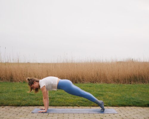 Camilla showing Plank Pose (Phalakasana) from the sun salutations in yoga